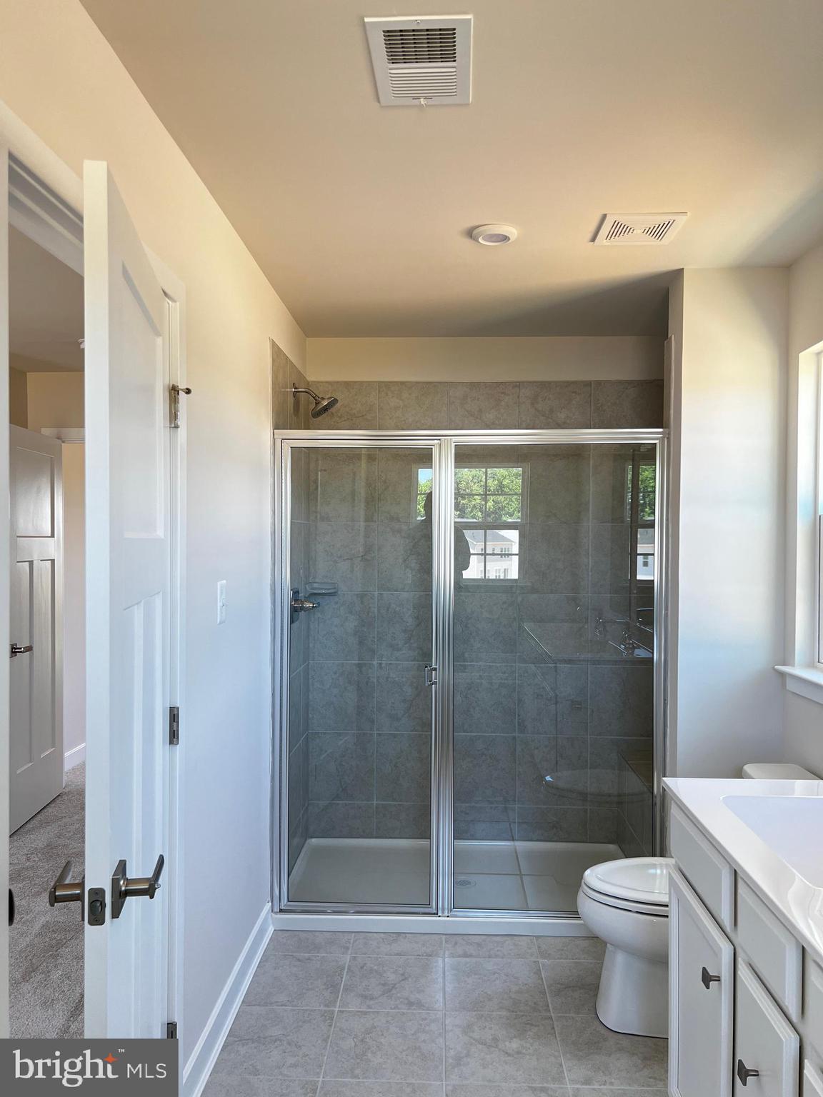 913 Ericcson Lane Middletown, DE 19709 - Photo 31 of 50 a bathroom with a shower a toilet and a sink