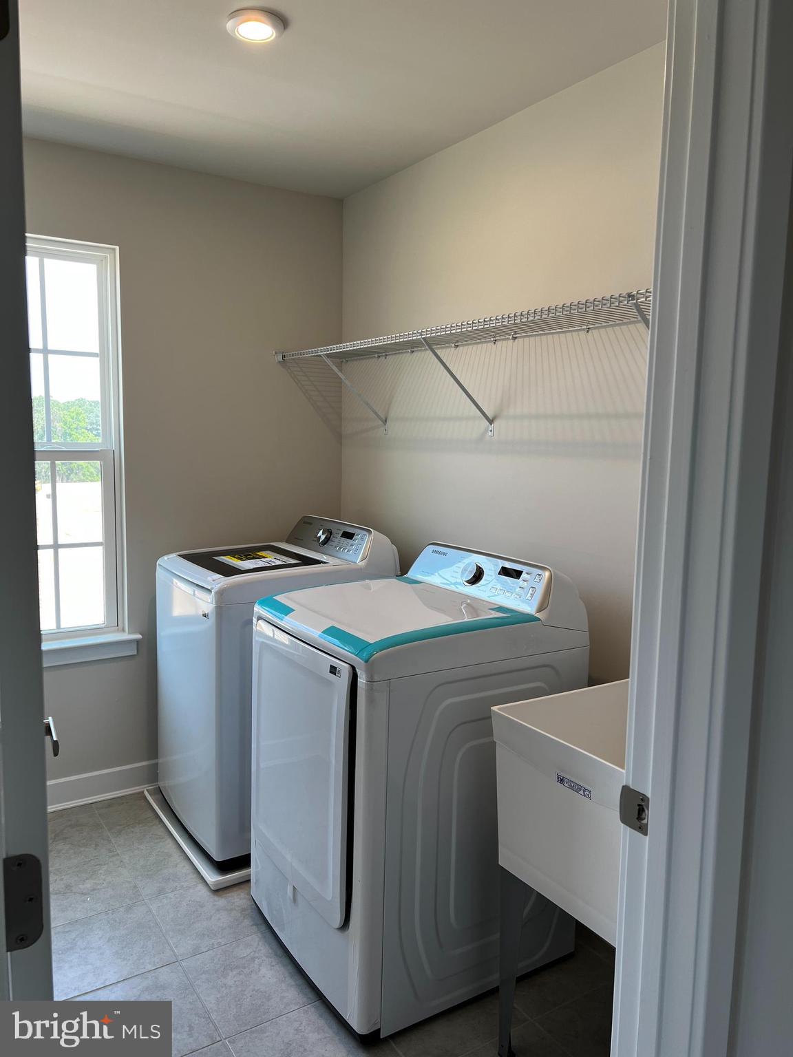 913 Ericcson Lane Middletown, DE 19709 - Photo 49 of 50 a utility room with dryer and washer