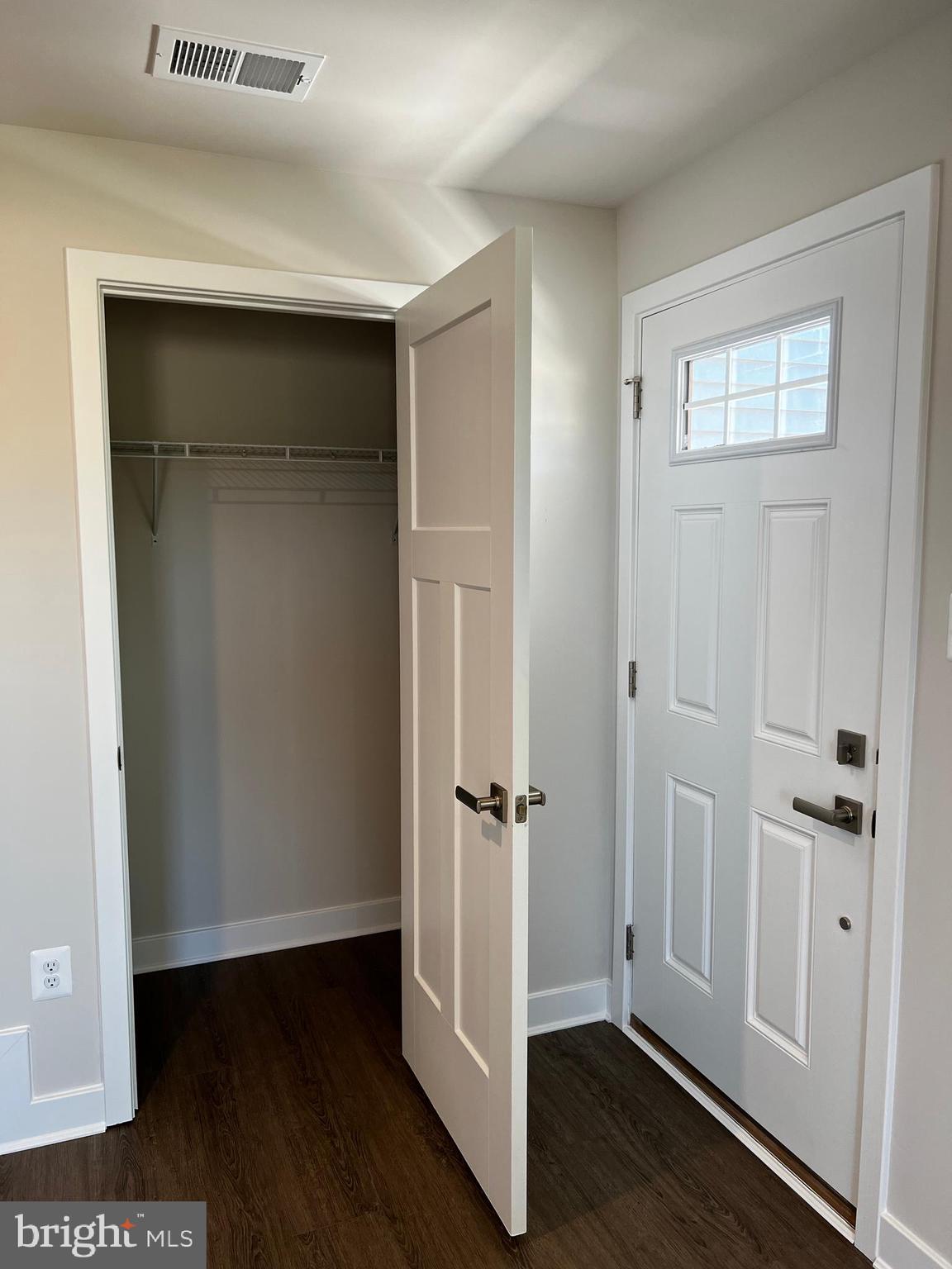 913 Ericcson Lane Middletown, DE 19709 - Photo 8 of 50 an empty room with wooden floor and closet area