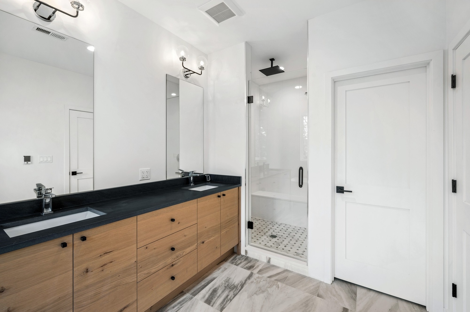 1816 Walnut Avenue Wilmette, IL 60091 - Photo 11 of 22 a spacious bathroom with a granite countertop sink mirror and shower