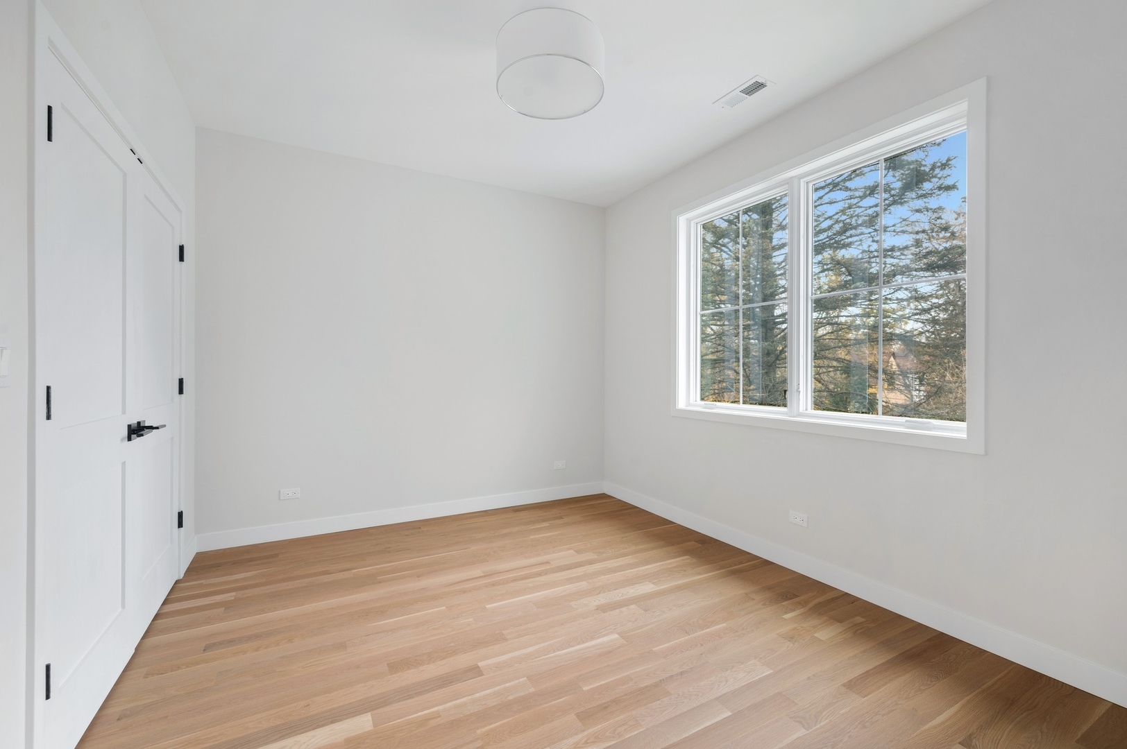1816 Walnut Avenue Wilmette, IL 60091 - Photo 14 of 22 a view of a room with wooden floor and windows