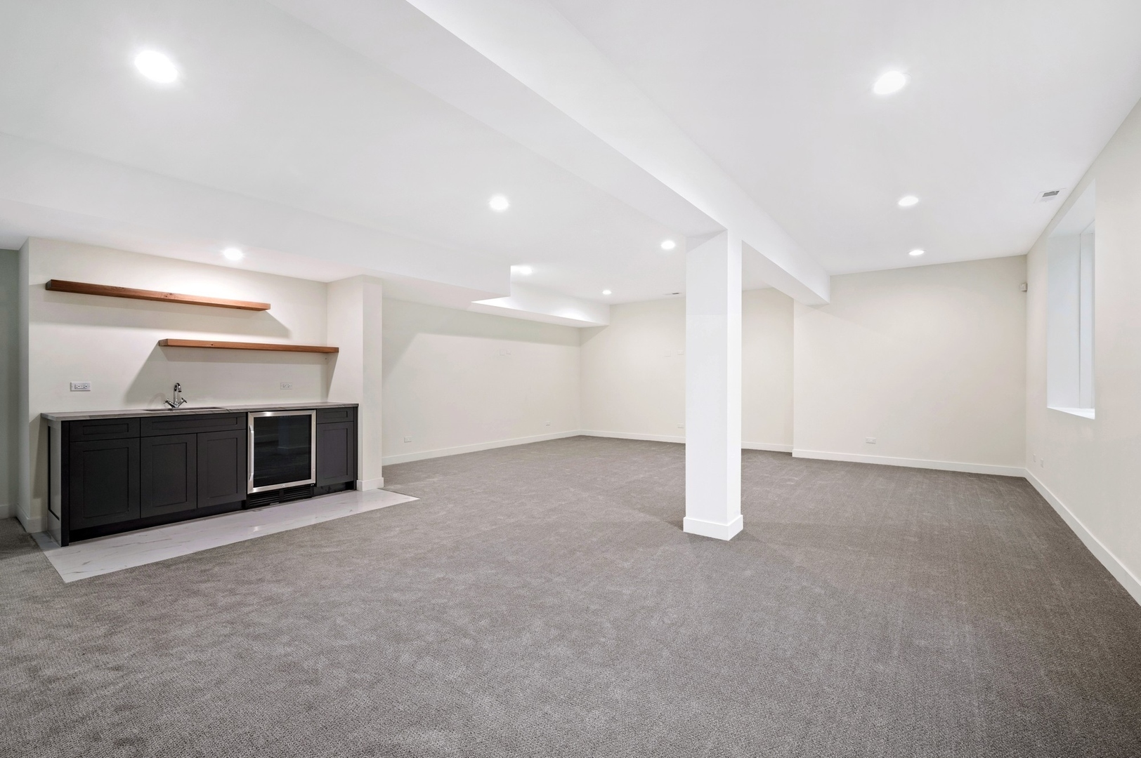 1816 Walnut Avenue Wilmette, IL 60091 - Photo 19 of 22 an empty room with a fireplace and window