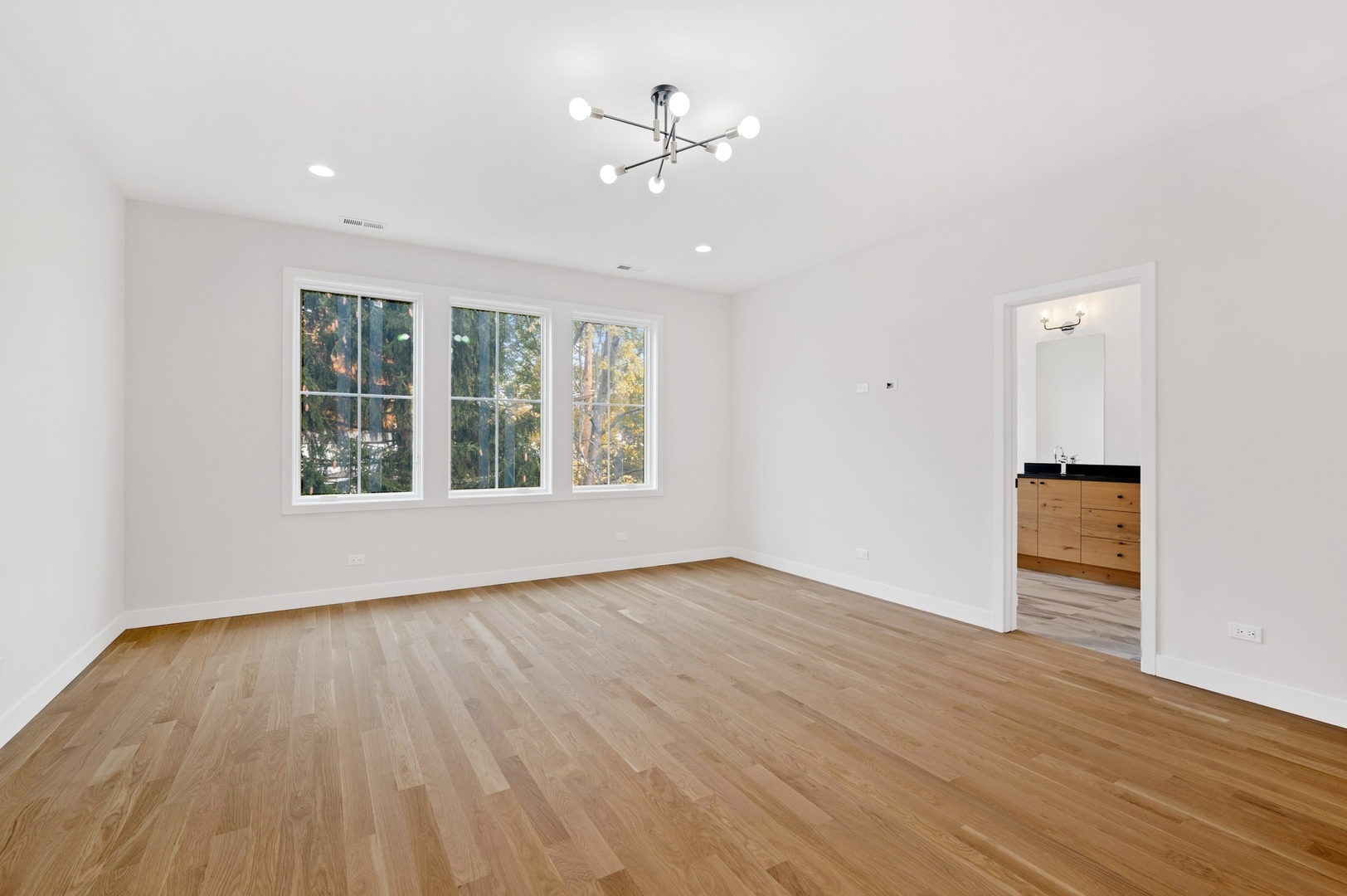 1816 Walnut Avenue Wilmette, IL 60091 - Photo 9 of 22 wooden floor in an empty room with a window