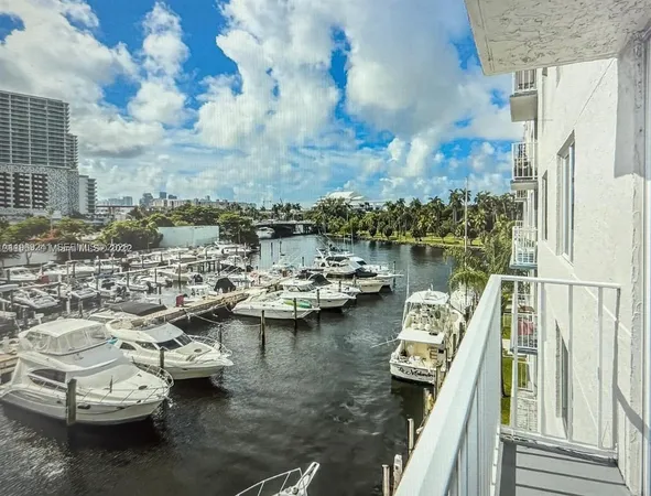 a view of a lake with tall buildings