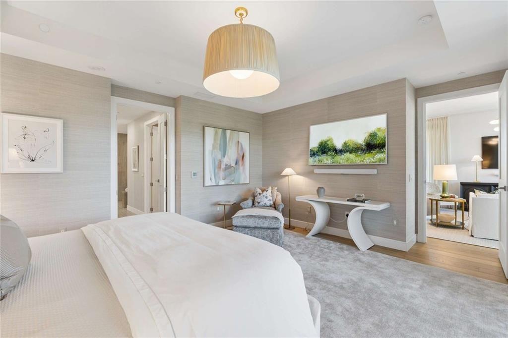 2520 Peachtree Road, Unit 603 Atlanta, GA 30305 - Photo 35 of 91 a bedroom with a bed and a chandelier