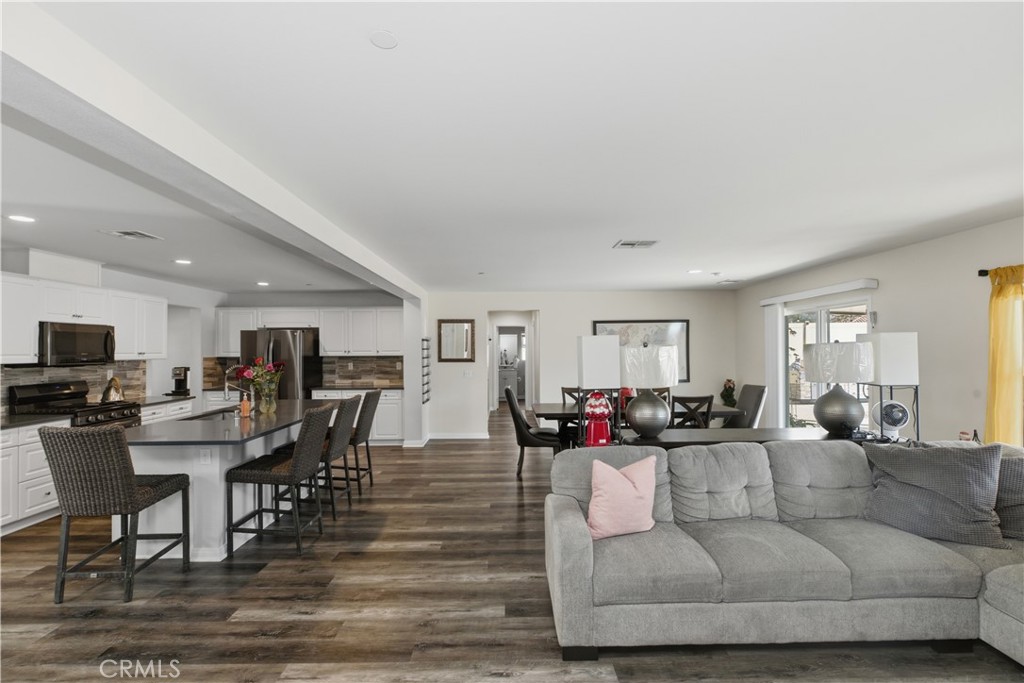 20583 Spring Street Riverside, CA 92507 - Photo 17 of 53 a living room with furniture and wooden floor