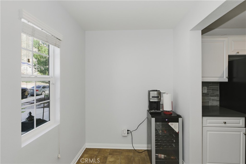 20583 Spring Street Riverside, CA 92507 - Photo 21 of 53 a view of a livingroom with wooden floor and a window
