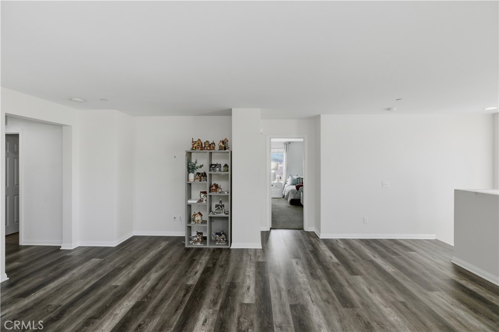 20583 Spring Street Riverside, CA 92507 - Photo 26 of 53 an empty room with wooden floor closet and windows