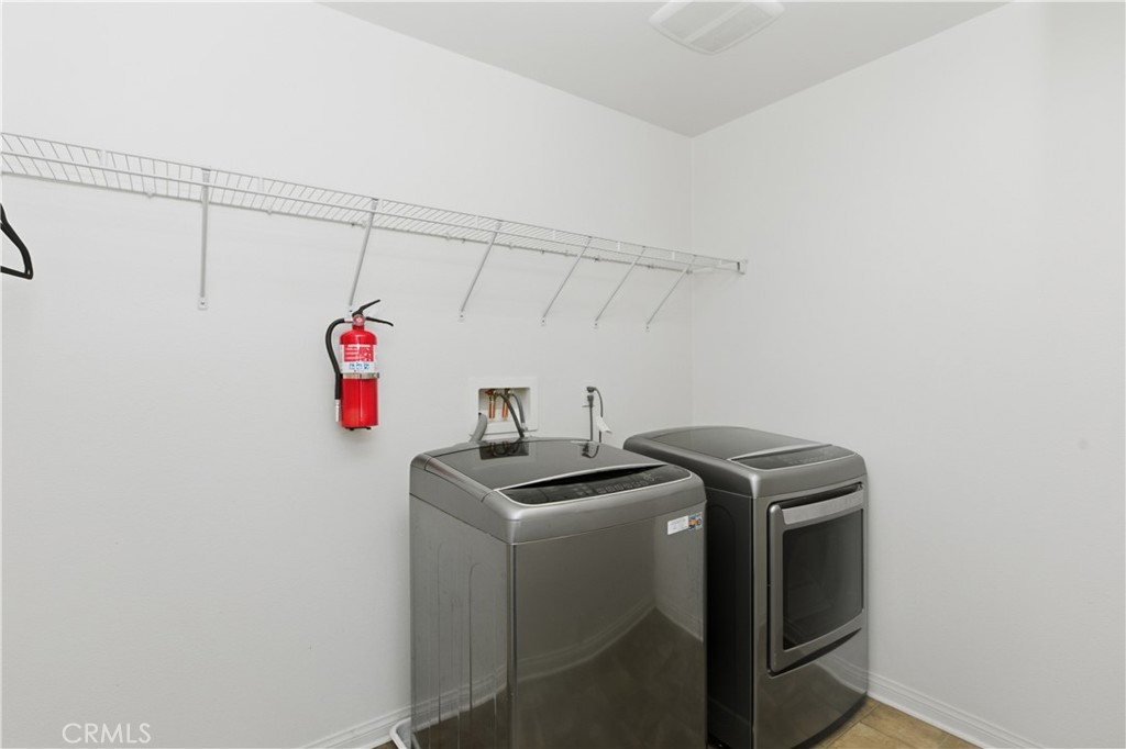 20583 Spring Street Riverside, CA 92507 - Photo 30 of 53 a utility room with dryer and washer