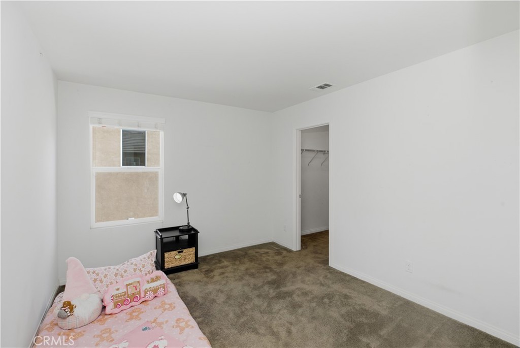 20583 Spring Street Riverside, CA 92507 - Photo 33 of 53 a bedroom with a bed and a window