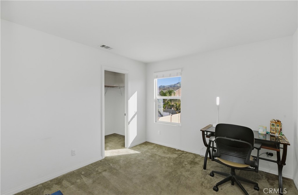 20583 Spring Street Riverside, CA 92507 - Photo 34 of 53 a workspace with furniture and a window