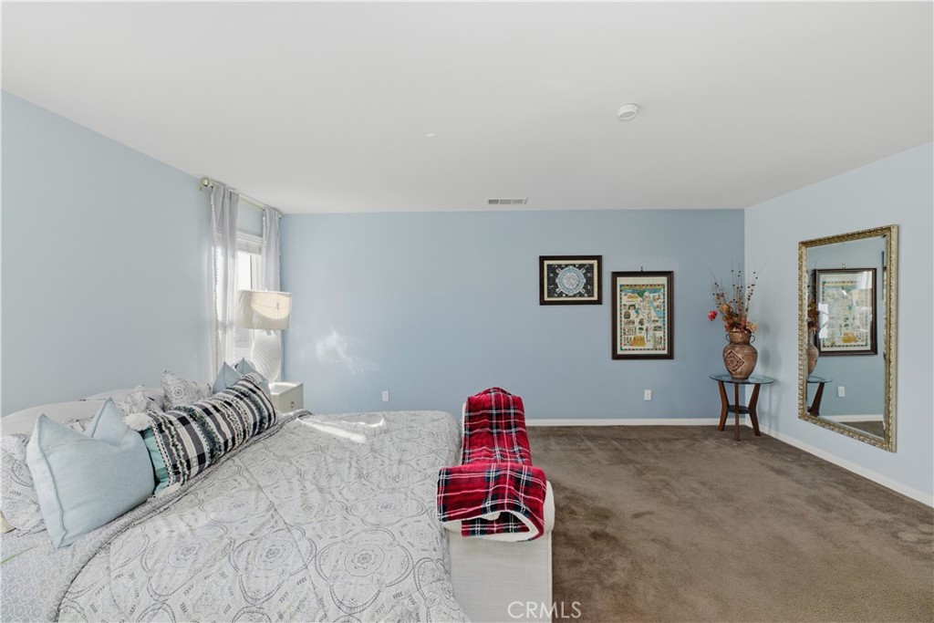 20583 Spring Street Riverside, CA 92507 - Photo 35 of 53 a bedroom with a bed and a couch