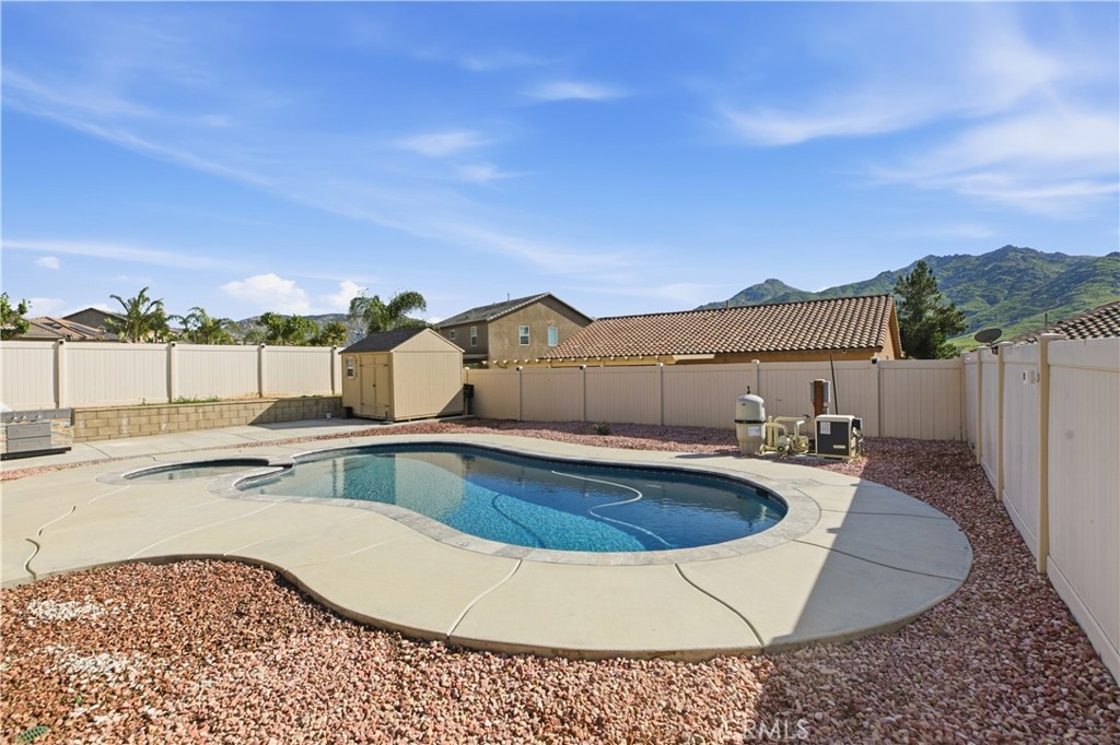 20583 Spring Street Riverside, CA 92507 - Photo 48 of 53 a view of a swimming pool with a lounge chair