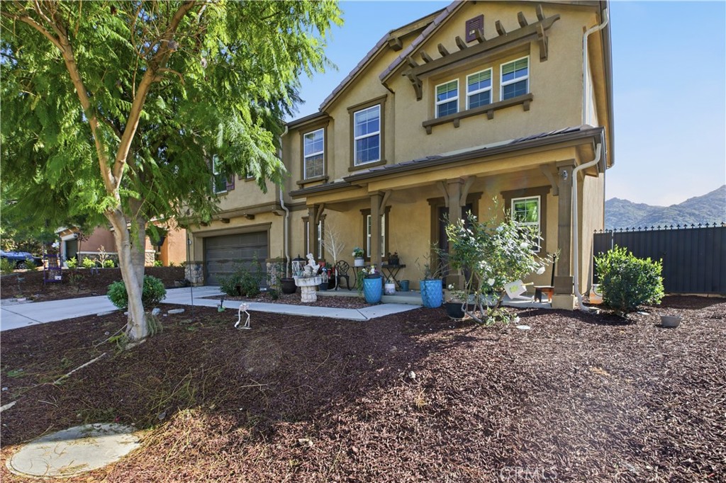 20583 Spring Street Riverside, CA 92507 - Photo 6 of 53 a view of a house with backyard porch and sitting area