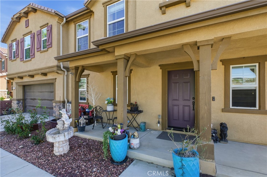 20583 Spring Street Riverside, CA 92507 - Photo 8 of 53 a view of a brick house with potted plants