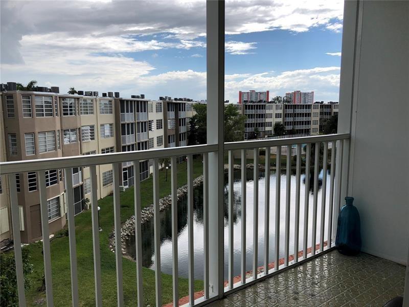 a view of a balcony with city view