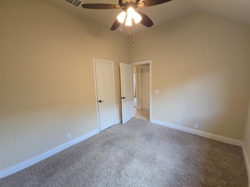 4031 Three Forks Road Kaufman, TX 75142 - Photo 12 of 26 a view of an empty room and chandelier fan