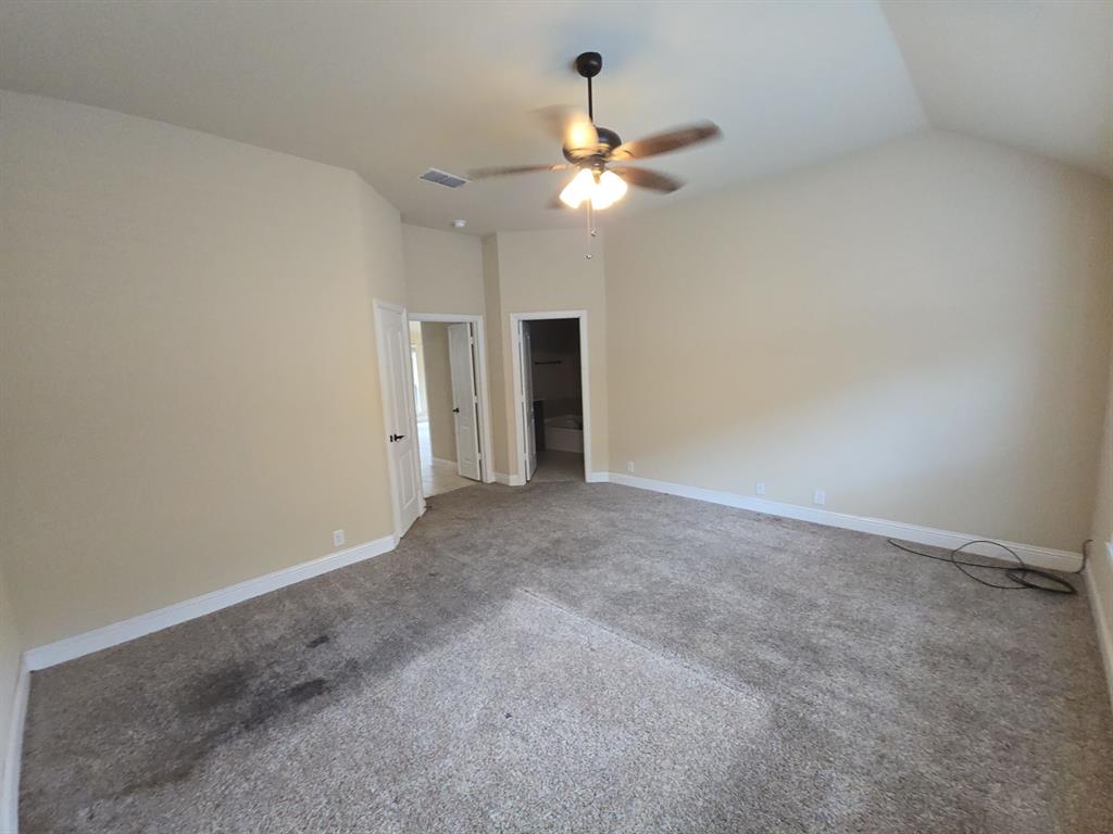 4031 Three Forks Road Kaufman, TX 75142 - Photo 15 of 26 a view of an empty room with a chandelier fan