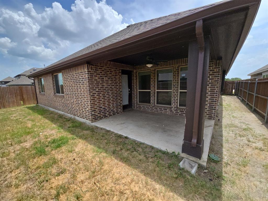 4031 Three Forks Road Kaufman, TX 75142 - Photo 22 of 26 a backyard of a house with table and chairs