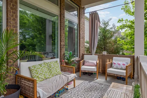 a outdoor living space with furniture and a potted plant