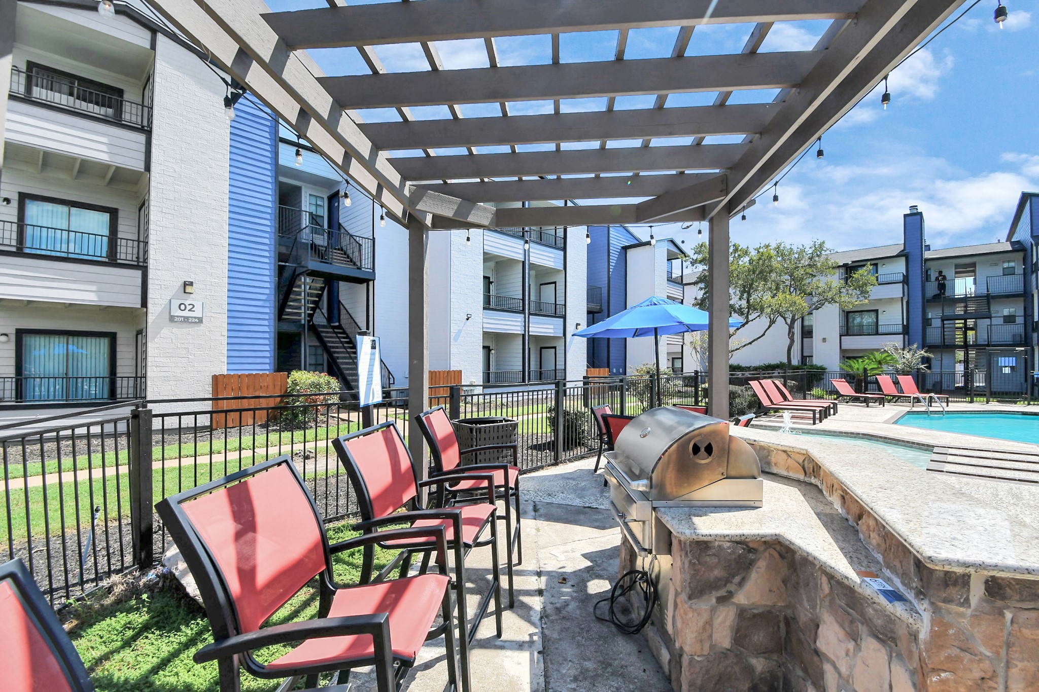 2701 West Bellfort Avenue, Unit 1016 Houston, TX 77054 - Photo 29 of 44 a building outdoor space with patio furniture and potted plants