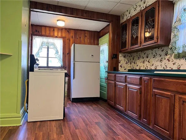 a view of a refrigerator and window