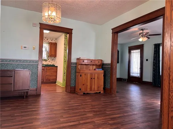 a view of a livingroom with furniture and wooden floor