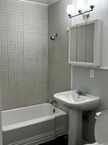 a bathroom with a sink and a bathtub