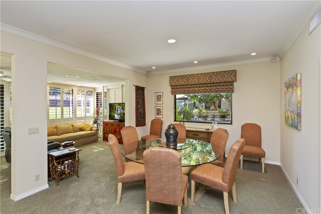 6272 Tecate Drive Riverside, CA 92506 - Photo 11 of 39 a dining room with furniture a fireplace and wooden floor