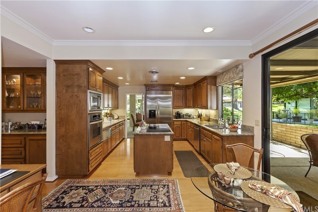 6272 Tecate Drive Riverside, CA 92506 - Photo 15 of 39 a living room with stainless steel appliances furniture wooden floor and a rug