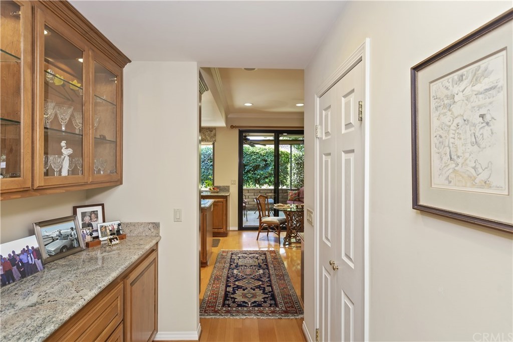 6272 Tecate Drive Riverside, CA 92506 - Photo 18 of 39 a kitchen with granite countertop a sink and a refrigerator