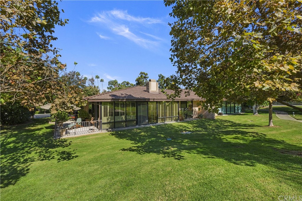 6272 Tecate Drive Riverside, CA 92506 - Photo 34 of 39 a view of a house with a big yard potted plants and large tree