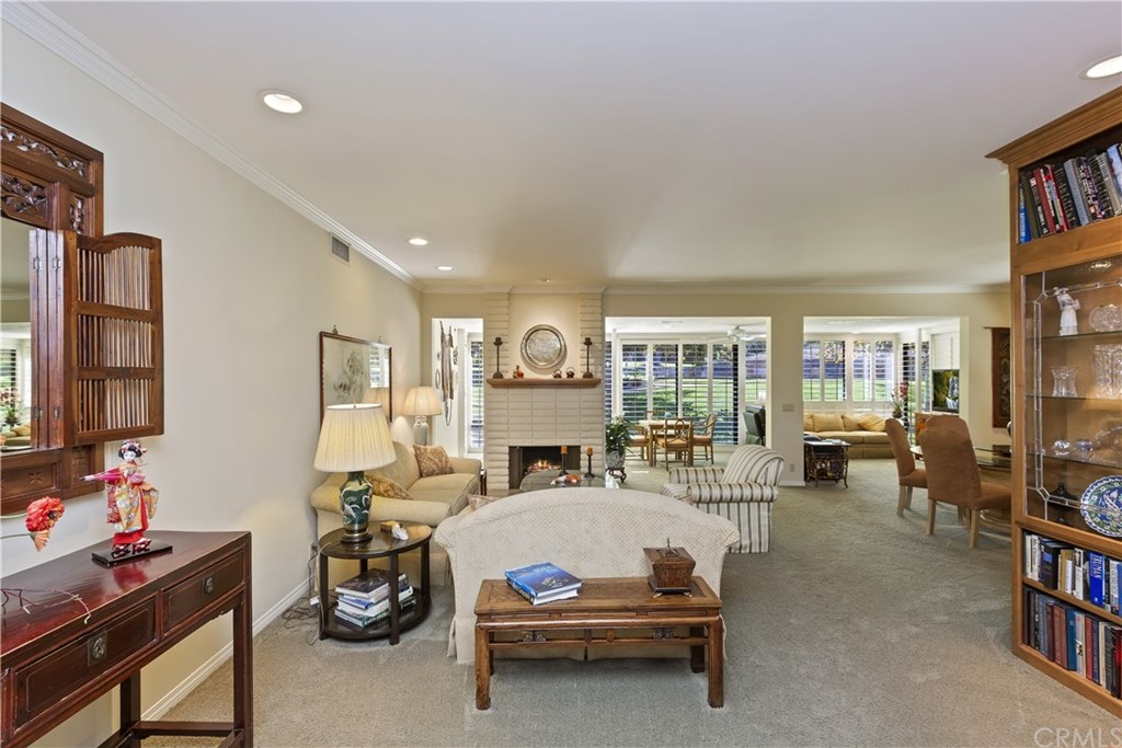6272 Tecate Drive Riverside, CA 92506 - Photo 7 of 39 a living room with furniture a fireplace and a flat screen tv