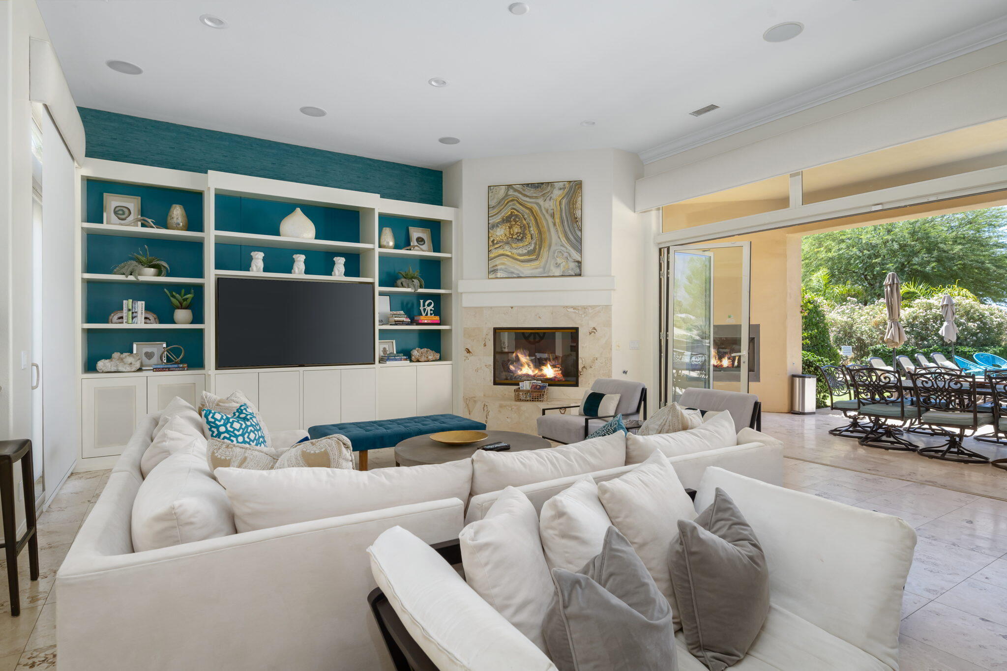 81785 Brown Deer Park La Quinta, CA 92253 - Photo 12 of 57 a living room with furniture fireplace and a large window