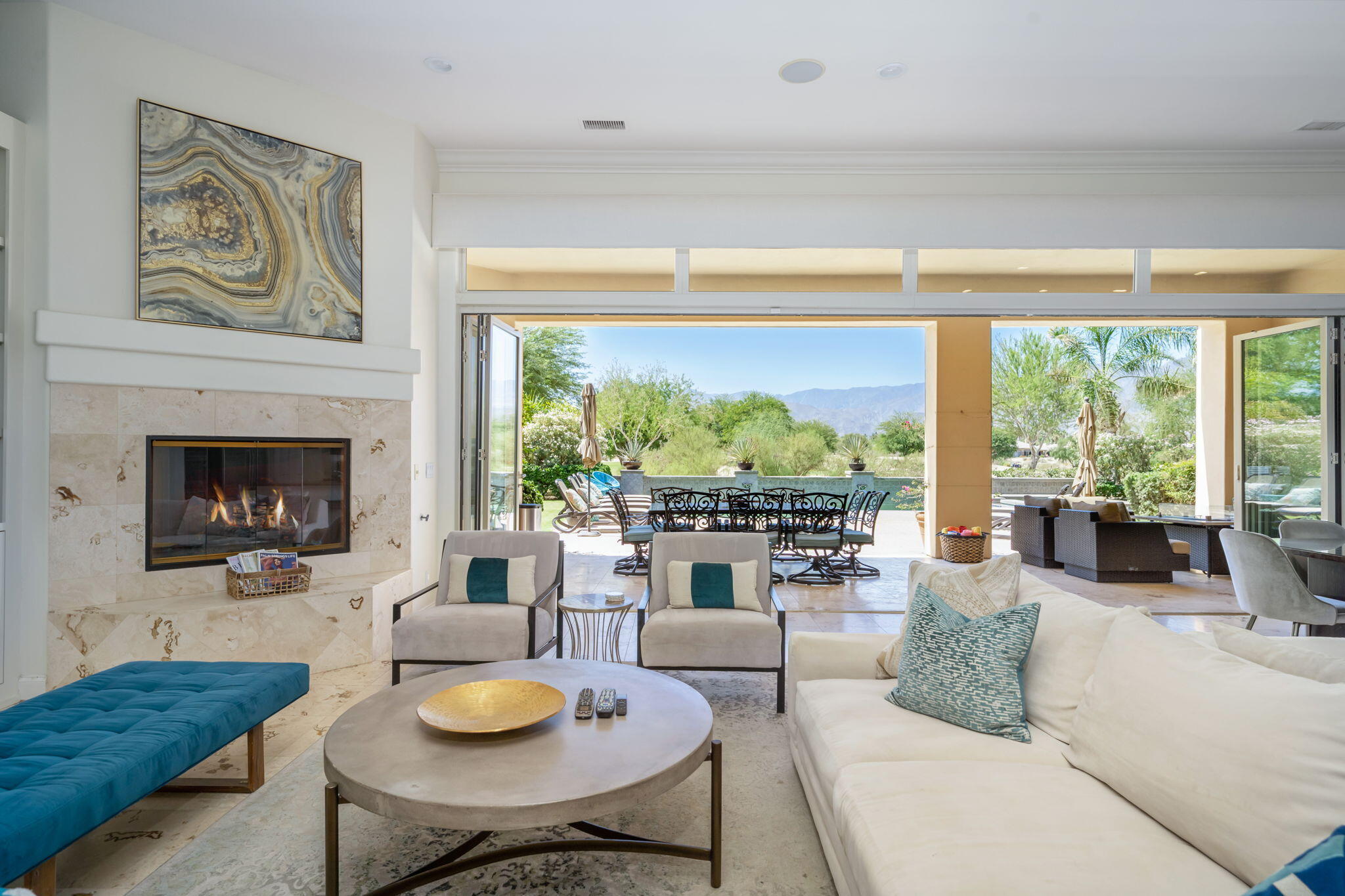 81785 Brown Deer Park La Quinta, CA 92253 - Photo 13 of 57 a living room with fireplace furniture and a large window