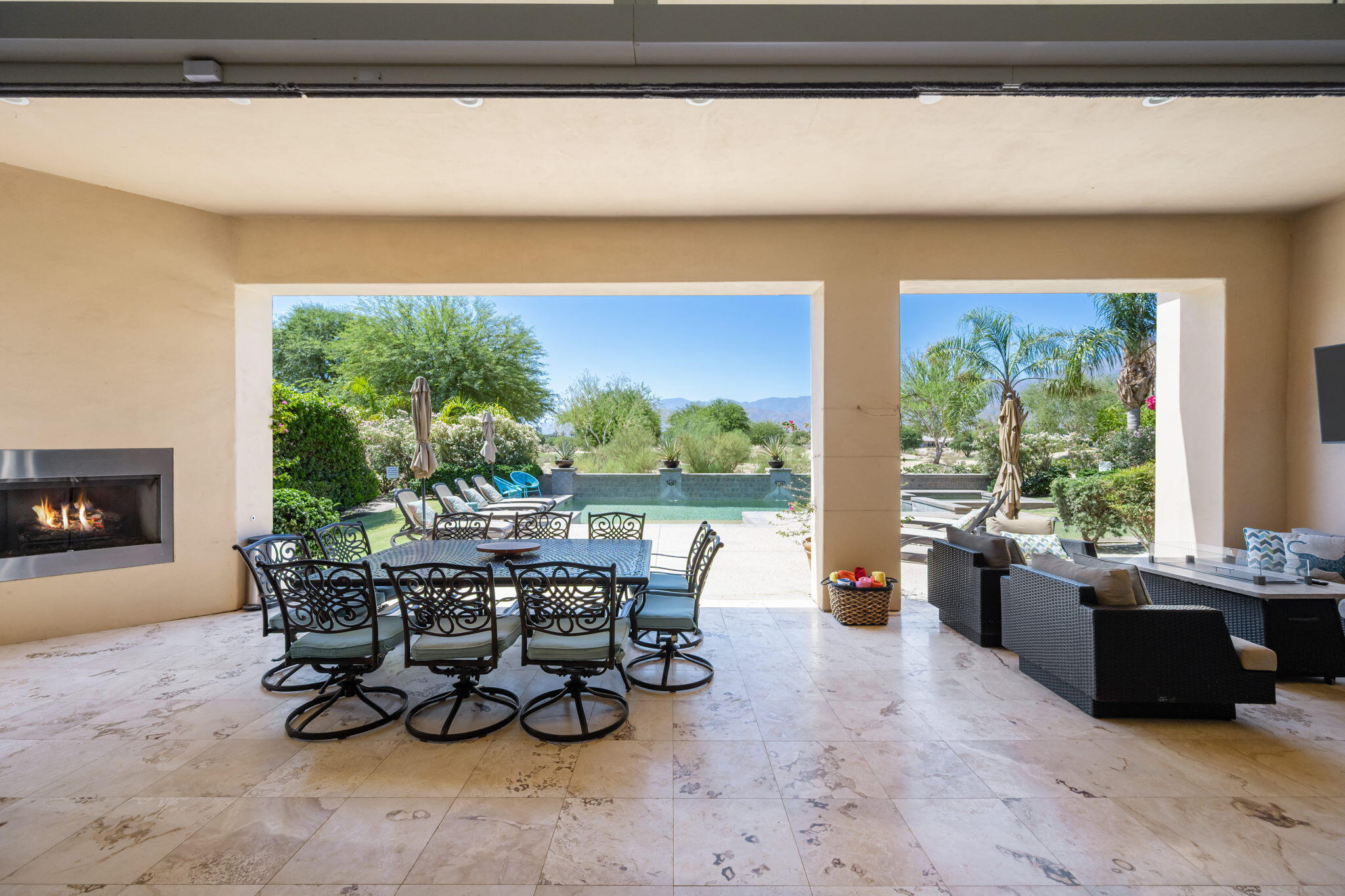 81785 Brown Deer Park La Quinta, CA 92253 - Photo 17 of 57 a living room with furniture and a fireplace