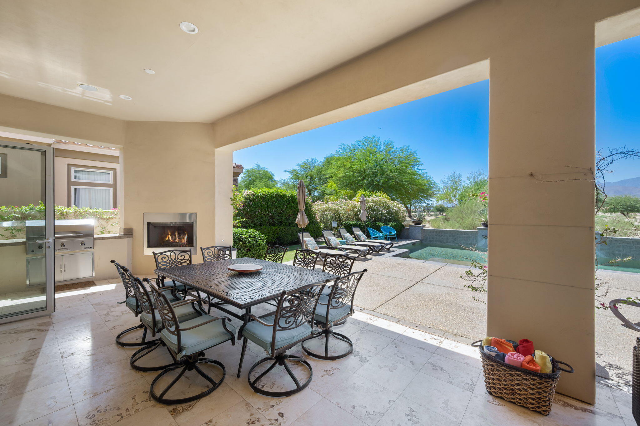 81785 Brown Deer Park La Quinta, CA 92253 - Photo 18 of 57 a dining room with furniture and a floor to ceiling window