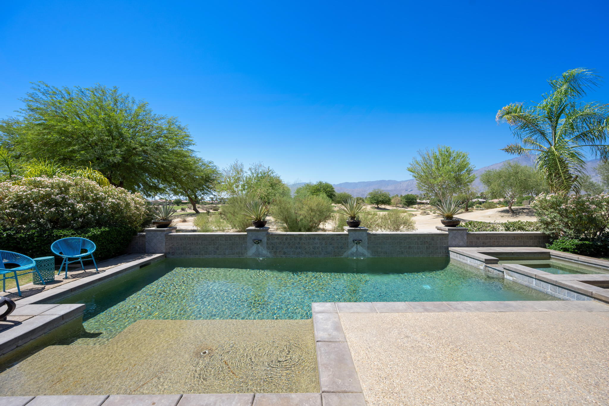 81785 Brown Deer Park La Quinta, CA 92253 - Photo 20 of 57 a view of yard with swimming pool and green space