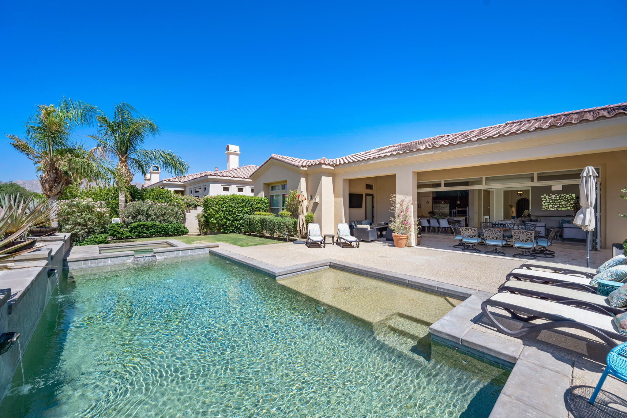 81785 Brown Deer Park La Quinta, CA 92253 - Photo 24 of 57 a view of a house with swimming pool and sitting area