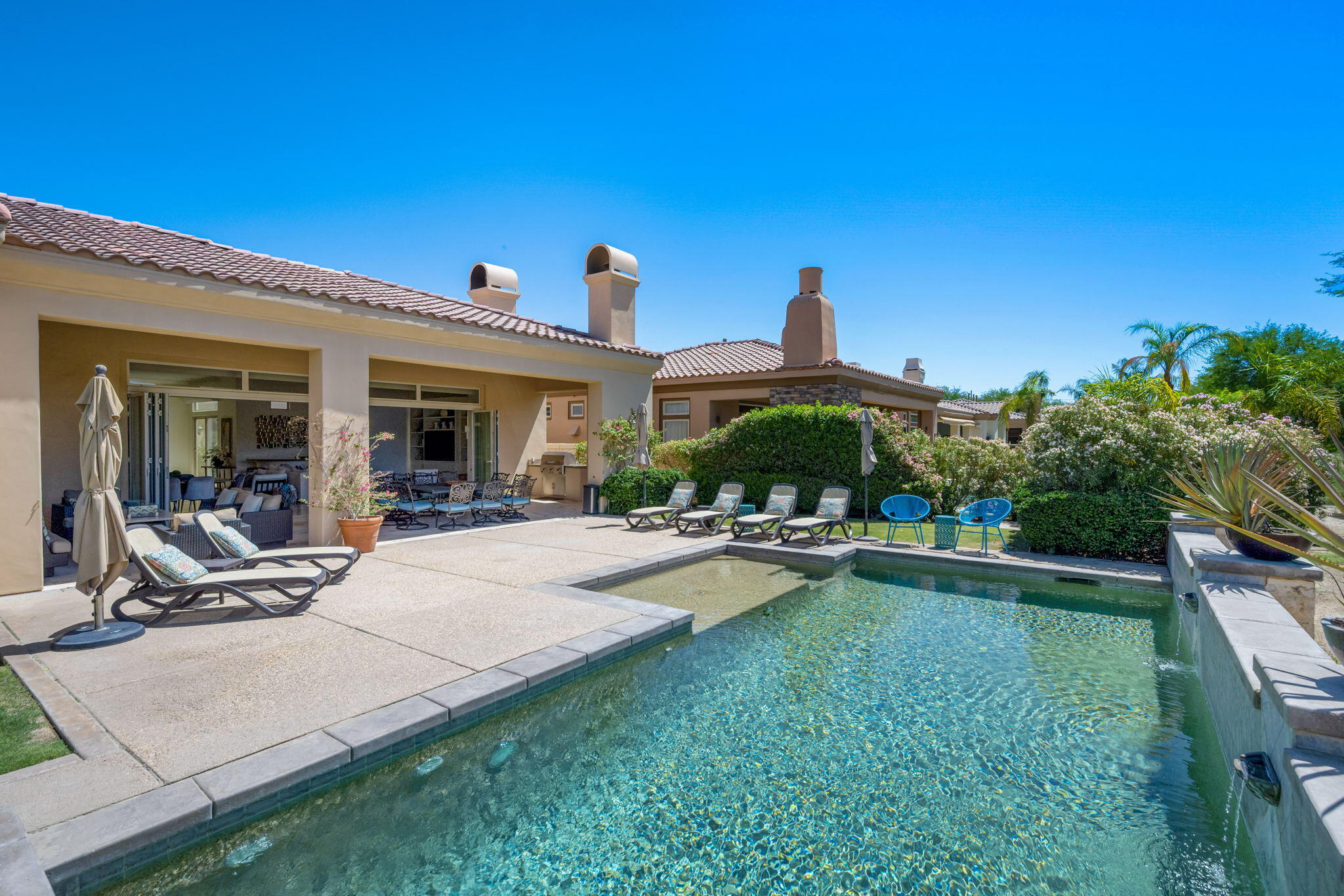 81785 Brown Deer Park La Quinta, CA 92253 - Photo 27 of 57 a view of a house with swimming pool and sitting area