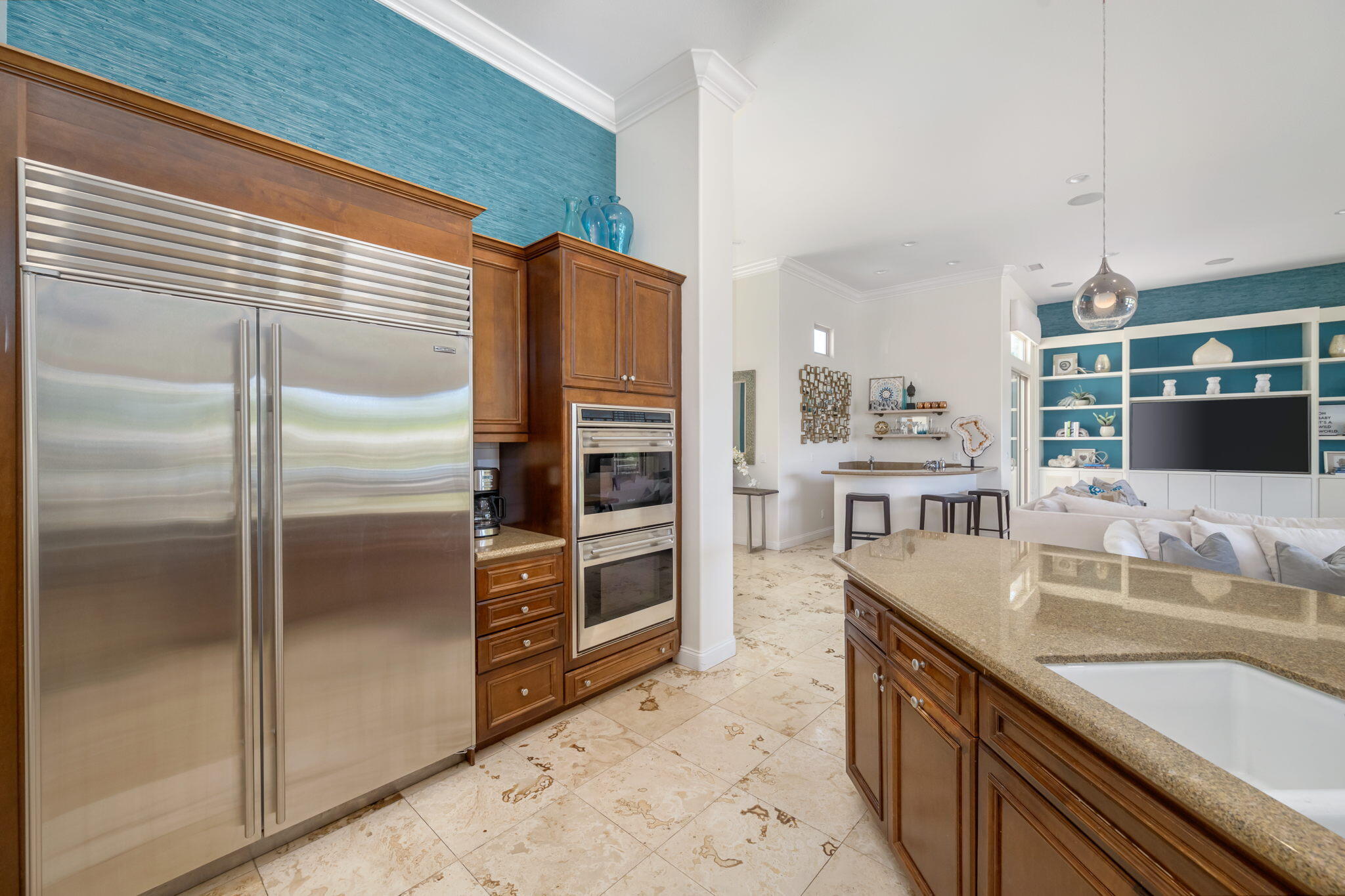 81785 Brown Deer Park La Quinta, CA 92253 - Photo 32 of 57 a kitchen with stainless steel appliances granite countertop a refrigerator and a sink