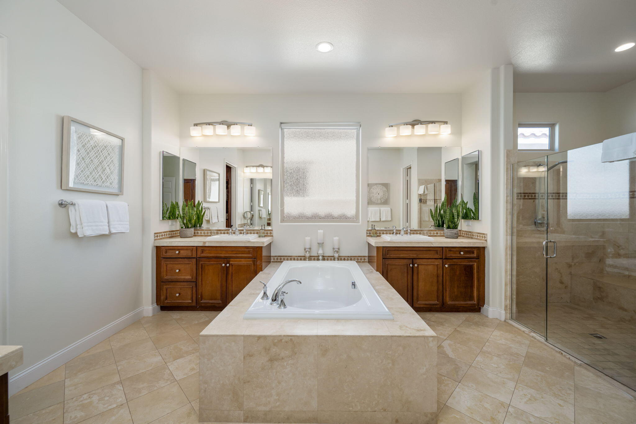 81785 Brown Deer Park La Quinta, CA 92253 - Photo 42 of 57 a large bathroom with a granite countertop double vanity sink a mirror and a shower
