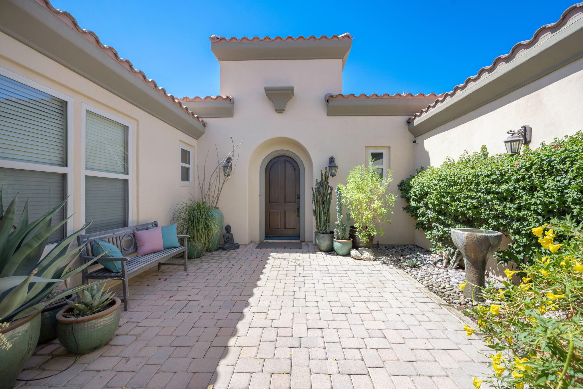 81785 Brown Deer Park La Quinta, CA 92253 - Photo 8 of 57 a view of a patio with table and chairs and potted plants