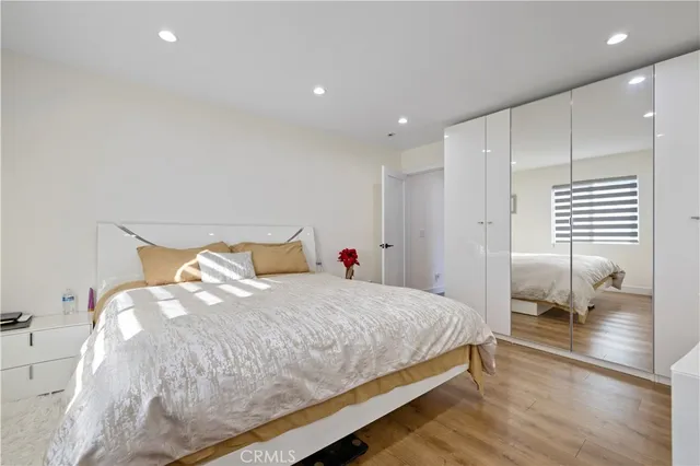 a large kitchen with stainless steel appliances granite countertop a lot of counter space and wooden floors