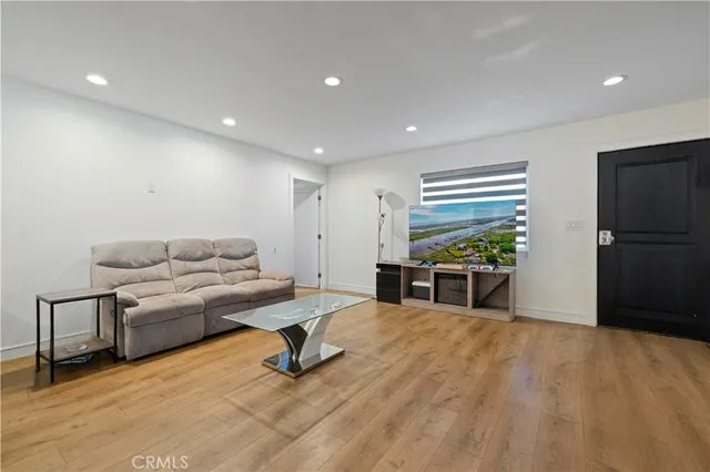 a kitchen with stainless steel appliances a sink dishwasher stove microwave and cabinets