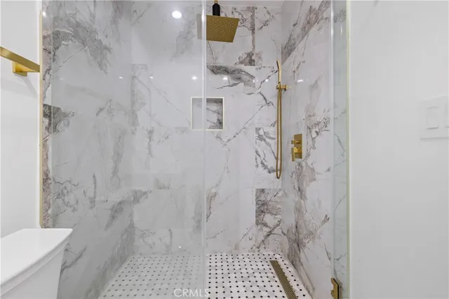 a view of a pathway of a house with wooden floor in front of main