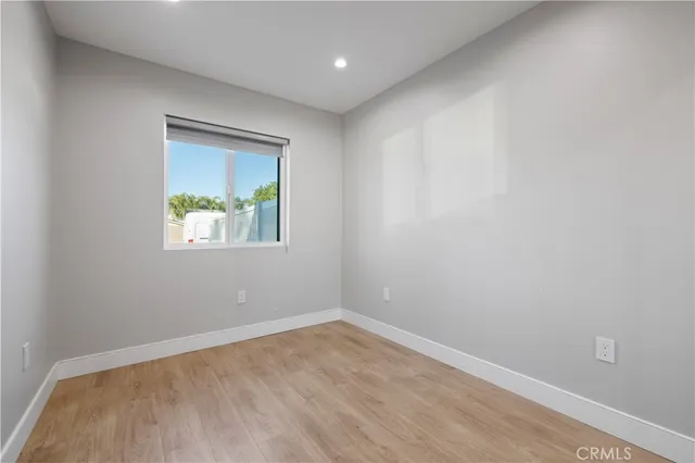 a bedroom with a bed and a lamp