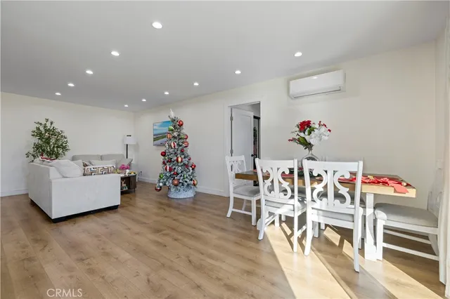 a living room filled with furniture and flowers