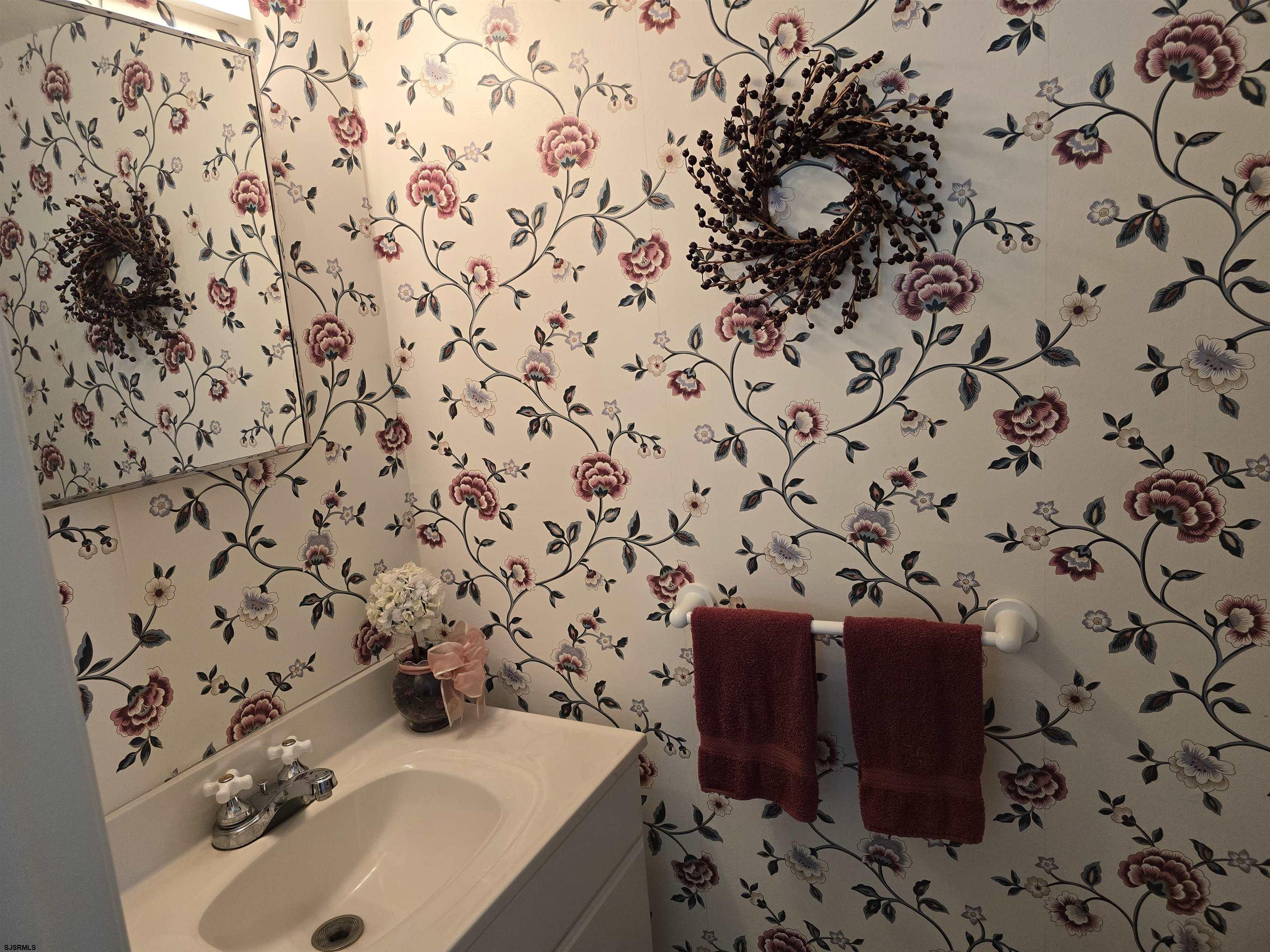9 Gull Cove Brigantine, NJ 08203 - Photo 18 of 20 a bathroom with a sink and a mirror