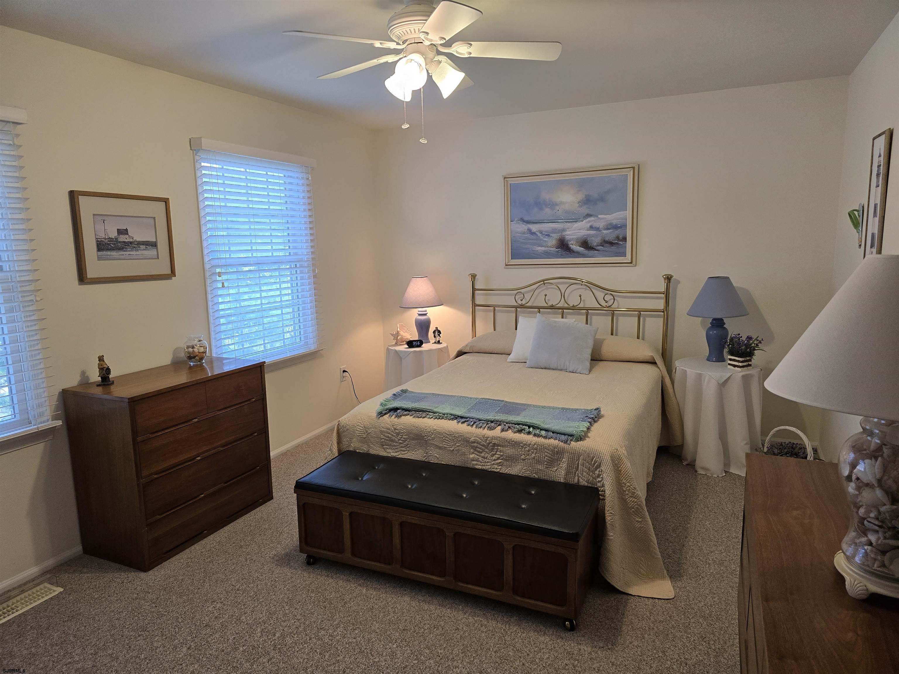 9 Gull Cove Brigantine, NJ 08203 - Photo 19 of 20 a bed room with a bed and a window